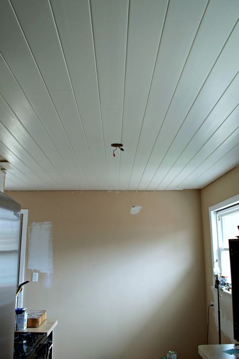 Adding recessed lighting to a small, dark galley kitchen. | chatfieldcourt.com Plank Kitchen Ceiling, Plank A Popcorn Ceiling, White Beat Board Ceiling, Plank Ceilings, Wood Plank Ceiling Lowe's, Kitchen Lighting Remodel, Kitchen Ceilings, Planking Ceiling Diy, Planked Ceiling