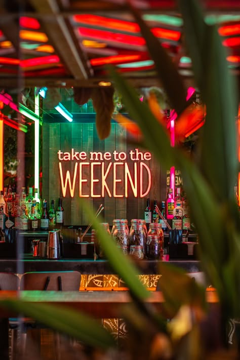 Beautiful back bar design. Take me to the weekend neon sign. Jungle bar. Rainforest Bar. Tropical bar. Jungle Themed Restaurant, Jungle Bar Design, Tropical Bar Design, Instagrammable Interior, Funky Restaurant, Bali Bar, Bombay Velvet, Back Bar Design, Eclectic Cafe