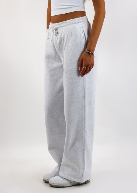 Stay cozy and stylish with these straight leg sweatpants! Featuring a relaxed straight-leg design with convenient pockets and a drawstring waist, these sweatpants are perfect for lounging or running errands. The soft fabric ensures all-day comfort, while the versatile grey hue makes them easy to style with your favorite casual tops. The Details Pockets Drawstring Waist Straight Leg 50% Cotton, 50% Polyester [#other] Machine Wash Cold with Like Colors Tumble Dry Low for 5 Minutes, Then Hang to Dr Sweatpants Collection, Plain Sweatpants, Sweatpants No Cuff, Light Grey Sweatpants, Wide Sweatpants, Casual Gray Straight Leg Sweatpants, Gray Trendy Straight Sweatpants, Sweatpants Grey, Comfy Gray Cotton Sweatpants