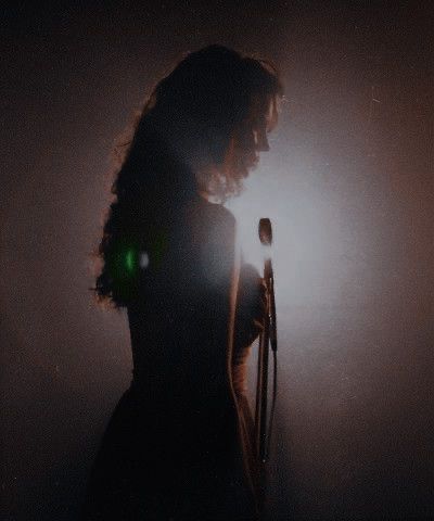 1950s Singer Aesthetic, Singing Dark Aesthetic, 80s Singers Aesthetic, Woman Bassist, Vintage Singer Aesthetic, Folk Singer Aesthetic, Dark Music Video Aesthetic, Lounge Singer Aesthetic, Singing Aesthetic Vintage