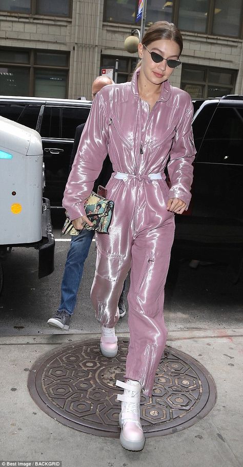 Gigi Hadid makes futuristic style statement in shiny pink jumpsuit and platforms while out in NYC | Daily Mail Online Fashion Jumpsuits, Celebrity Fashion, Pink Futuristic Outfit, Futuristic Aesthetic Outfit, Futuristic Jumpsuit, Pink Catsuit, Scifi Jumpsuit Concept, Gigi Hadid Jumpsuit, Kylie Jenner Pink Jumpsuit