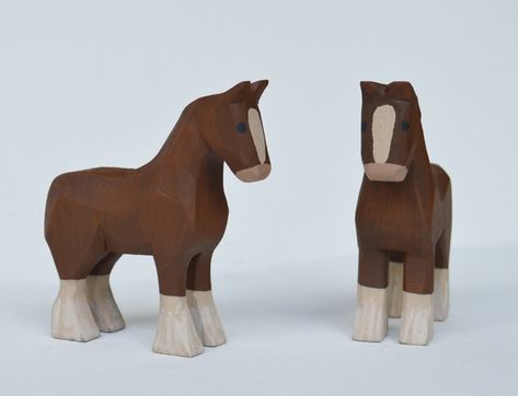 "A pair of Hand carved wooden Clydesdale Horse made from bass wood, hand painted with acrylic paints. Measurements are approximately 3\" inches long, 1\" wide and 3 1/4\" high *Animals are sold by the pair. Message me if you would like to purchase just one, I would be happy to set up a custom listing for you. Mo and Kelly Dallas have been making a living producing Hand Carved wooden Noah's Arks, Angels & other folk art in our home studio in rural Ohio for over 20 years. All of our products are h Wooden Figurines Handmade, Hand Carved Wooden Toys, Hand Carved Wooden Animals, Whittled Animals, Wooden Animals Patterns, Whittling Patterns Beginner, Easy Whittling Projects, Horse Wood Carving, Wooden Diy Crafts