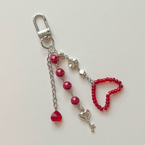 Handmade keychain with faux pearls a key charm silver chain and red hearts Red And Black Bead Keychain, Red Beaded Keychain, Diy Heart Keychain, Red Keychain Aesthetic, Valentine Keychain Diy, Purple Mochi, Valentines Keychain, Track Bag, Valentines 2023