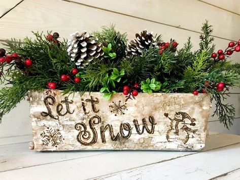 The snowman artwork and "let it snow" lettering is wood-burned onto the birch bark by hand. A perfect compliment to hold your Christmas flower arrangements! Create a wonderfully rustic centerpiece for your table or fireplace mantle. Its size and shape make this container super versatile. You can fill this rustic vase with greens, berries, pine cones, or even holiday treats! #boutiquebarnonetsy #letitsnow #snowmandecor #christmascenterpiece Christmas Greenery Arrangements, Wood Box Decor, Flower Arrangement Supplies, Birch Vase, Log Centerpieces, Black Bear Decor, Rustic Table Centerpieces, Box Centerpiece, Moose Decor