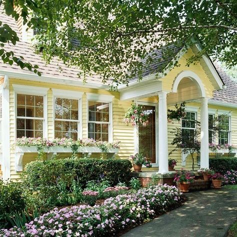 Yellow house via bhg.com Yellow House Exterior, Exterior Siding Colors, Exterior House Siding, Yellow Front Doors, Front Yards Curb Appeal, Best Exterior Paint, Small Cottages, Storybook Cottage, Front Doors With Windows