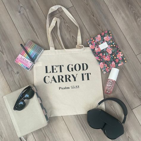 Introducing our "Let God Carry It" tote bag, a stylish and meaningful accessory designed to lighten your load and lift your spirits. This versatile tote features a simple yet powerful message: "Let God Carry It," reminding you to release your burdens and trust in a higher power. Crafted from durable materials, this tote is perfect for carrying groceries, books, or everyday essentials, while its spacious interior and sturdy handles ensure practicality and comfort. Whether you're running errands o Christian Tote Bags Paint, Bible Study Bag Totes, Cricut Bags, Tote Bag Sayings, Simple Tote Bag Design, Bible Accessories, Tote Bags Diy, Bible Bags Totes Diy, Cricut Tote Bag Ideas