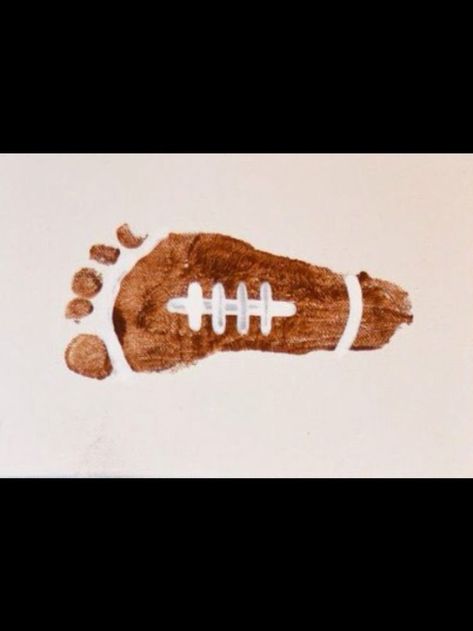 Football Footprint Skeleton Footprint Art, Baby Footprint Art Fall, Infant Artwork Ideas, Football Infant Art, Brown Crafts For Toddlers, Fall Hand And Foot Print Crafts, Fall Baby Footprint Art, Fall Baby Art Projects Infants, Fall Crafts Infants