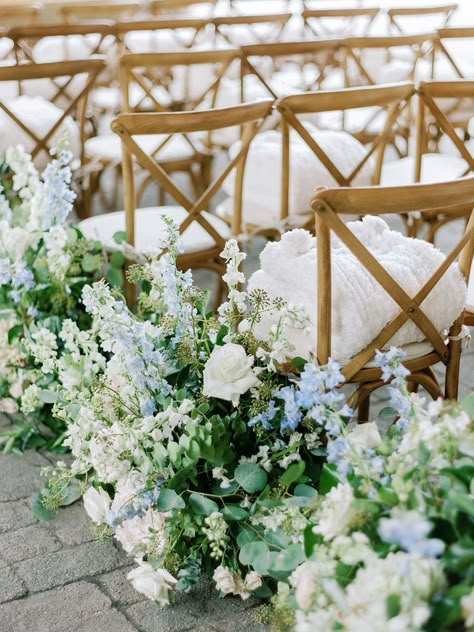 Dusty Blue Pillar Candles Wedding, Light Blue White And Greenery Wedding, Spring Floral Wedding Aisle, Blue And White Wedding Aisle Flowers, Blue And White Aisle Arrangements, Blue And White Wedding Ceremony Flowers, Blue And White Garden Party Wedding, Dusty Blue White And Greenery Wedding, White Wedding Flowers Hint Of Blue