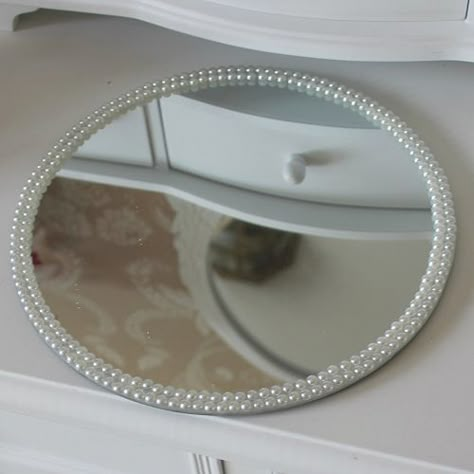 Round Pearl Mirrored Plate  Beautiful wedding centrepiece idea  Ideal as a candle plate or for displaying a centrepiece  Pearl detailing around the edges  Measures: 20.5cms in diameter  http://www.melodymaison.co.uk/product.php?productid=19897=265=1 Mirror Plate Decor Ideas, Mirror Plate Centerpiece Wedding Ideas, Pearl Mirror Diy, Nikah Mirror Plate, Round Mirror Diy, Draps Design, Decorated Mirror, Pearl Mirror, Girls Room Diy