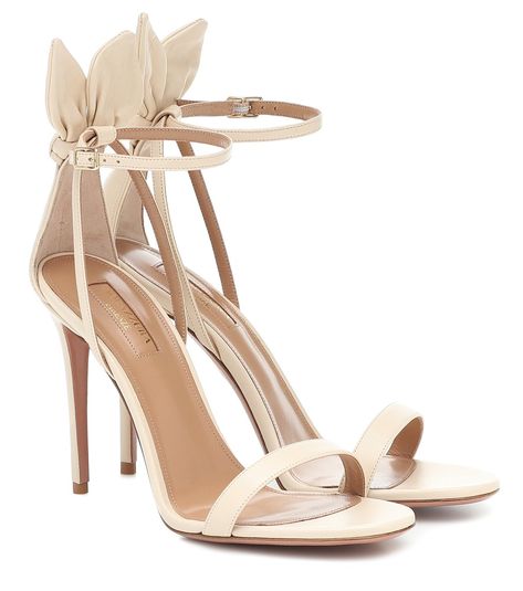 Aquazzura - Deneuve 105 leather sandals - Stride into the new season in the Deneuve leather sandals from Aquazzura. Crafted in Italy from supple leather in an elegant cream hue, the style features 105mm stiletto heels and flirty bow detailing at the ankles. Let this pair elevate your ensemble for after-dark events. seen @ www.mytheresa.com Aquazurra Shoes, Aquazzura Bow Tie, Floral Flat Shoes, Mode Dope, Hak Tinggi, Balenciaga Leather, Glitter Sandals, Rubber Sandals, Embellished Sandals