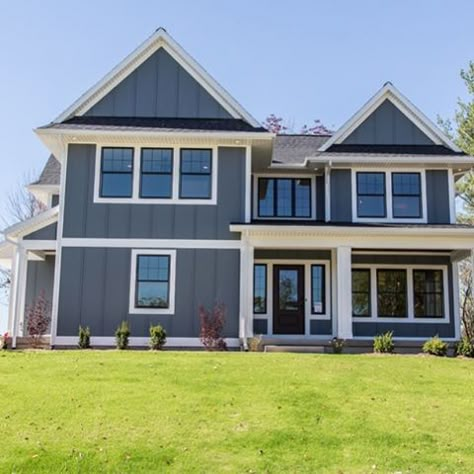 Officially ordered the exterior paint for the house today. That means that painting the siding is right around the corner. Here's the inspiration image - dark grey siding with white trim and black windows. (Photo via Hanson Homes on @houzz.) #newlywoodwardsbuildahouse Siding House, Best Exterior House Paint, Exterior Farmhouse, White Farmhouse Exterior, Exterior Gray Paint, Exterior Windows, Covered Entry, Siding Ideas, Gray Exterior