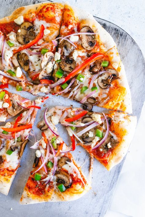 This veggie supreme pizza is supremely delicious! It's fully loaded with sauteed mushrooms, green pepper, red onion, feta cheese and oregano. Supreme Pizza Recipe, Pizza Supreme, Flat Bread Recipes, Pepper Pizza, Pizza Healthy, Meal Planning Recipes, Supreme Pizza, Best Homemade Pizza, Best Pizza Dough