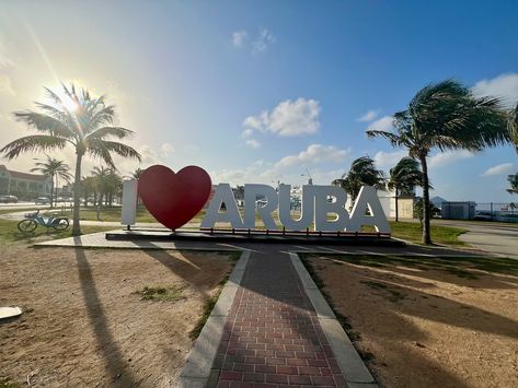 Walking towards the I Love Aruba sign near the cruise port in Oranjestad. Have you visited the island? If so, what was your favorite thing to do in Aruba? #CaribbeanAndCo #TravelWithCaribbeanAndCo Aruba Oranjestad, St Eustatius, Oranjestad, Countries To Visit, Caribbean Travel, Cruise Port, All Inclusive Resorts, Aruba, Luxury Hotel