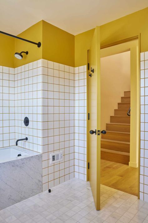 9 Shower Tile Ideas to Inspire Your Bathroom Renovation 80s Tile Bathroom, Tile Joints Color, Yellow Grout Bathroom, Mosaic Floor Tiles Bathroom, Grid Tile Bathroom, Microcement And Tile Bathroom, White Square Tile Bathroom, Colourful Bathroom Tiles, Tiled Shower Stall