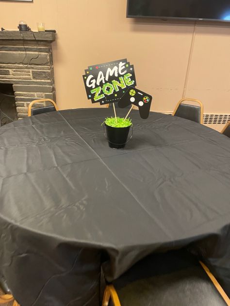 Black bucket with crinkle paper center piece. #videogameparty #blackandgreen #gamer Gaming Centerpieces, Gamer Centerpieces, Black Bucket, Video Games Birthday, Video Game Party, Birthday Party Centerpieces, Birthday Table, Table Centers, Party Centerpieces