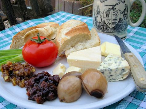 Just the words Ploughmans Lunch, conjures up images of lazy lunches sat outside with friends, in the Beer Garden of an old Country Pub! This is one of the most famous of pub lunches - so simple and yet so satisfying, especially if taken with a pint of real ale or cider!  Although the term Ploughman’s Lunch was first coined in the 1930’s, as part of a very successful marketing campaign, the concept behind it goes back much further. Throughout the centuries, agricultural workers would take the... Branston Pickle Recipe, English Salad, English Lunch, Ploughman's Lunch, Cottage Loaf, Branston Pickle, Lunch Photo, Ploughmans Lunch, Tustin California