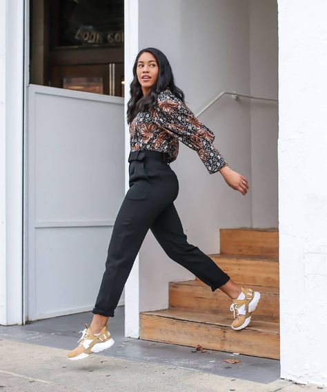 18 Outfits That Prove Sneakers Go With Everything | The Everygirl Work Outfits With Athletic Shoes, Work Outfits With Gym Shoes, Work Outfits Women Office With Sneakers, Office Wear With Trainers, Trainers For Work Outfit, White Puma Sneakers Outfit Street Styles, Business Casual Outfits With Sneakers Work, Black Outfit With Sneakers Casual, Sneakers For The Office Women