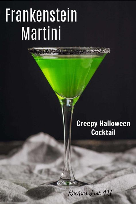 This fun Halloween cocktail recipe is called the Frankenstein drink. It uses Frank's two colors - black and green - and black sanding sugar to create a spooky effect. Get the recipe on Recipes Just 4U. Frankenstein Drink, Frankenstein Cocktail, Halloween Black Drink, Halloween Martini Recipes, Black Vodka Halloween Drinks, Green Halloween Cocktails Recipes, Apple Pucker Drinks, Green Martini, Halloween Martini