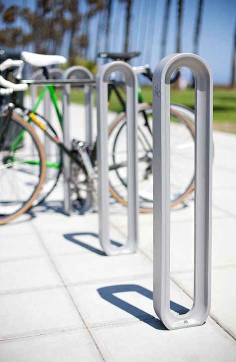 Olympia Bike Racks shown with Aluminum Texture powdercoat Bike Rack Design, Bike Rack Outdoor, Bicycle Rack Design, Bicycle Parking Design, Aluminum Texture, Rack Velo, Street Bike Helmets, Bike Parking Rack, Outdoor Furniture Ideas