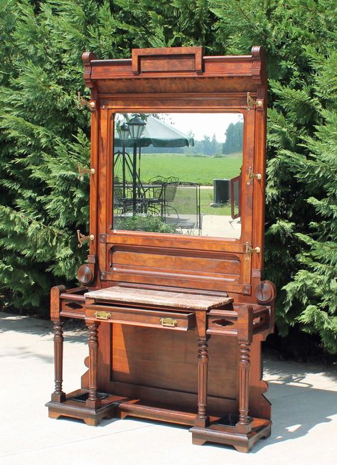 Eastlake Hall Tree, Walnut & Burl walnut, Victorian. Marble top desktop, brass coat hooks. Single storage drawer and built in umbrella holders. 84" tall, 50" wide, 13" deep, 135 lbs. Victorian Hall, Brass Coat Hooks, 135 Lbs, Walnut Burl, Umbrella Holder, Hall Tree, Storage Drawer, Coat Hooks, Marble Top