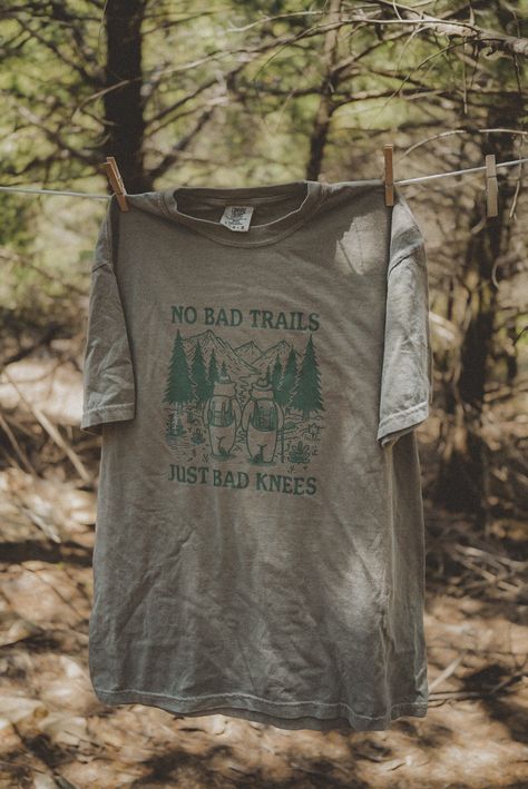 No Bad Trails, Just Bad Knees graphic t-shirt. Each t-shirt is pressed house on a comfort colors unisex shirt. T-shirts are made of a soft cotton blend and features a vibrant direct to fabric transfer design that won't fade or crack. COLOR PICTURED: KHAKI Shop our wanderlust inspired t-shirt collection. Perfect for those who enjoy hiking, camping, exploring the outdoors and all adventure seeking enthusiasts. keywords: wanderlust t-shirt, adventure t-shirts, graphic tees, unisex outdoorsy shirts, Outdoorsy Aesthetic, Outdoorsy Shirt, Hiking Apparel, Travel Apparel, Bad Knees, Outdoor Aesthetic, Projets Cricut, Hiking Shirt, Shirts Graphic