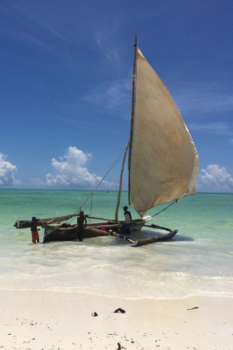 kids playing with a local dhow boat in shallow water of the west coast of zanzibar Zanzibar Beaches, Old Sailing Ships, Shallow Water, Summer 2025, Mozambique, Sailing Ships, West Coast, Kids Playing, Boats