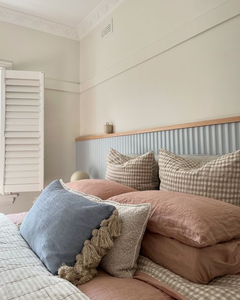 “Give me a calming serene oasis bedroom vibe in a house full of boys!” Done ✅ We loved putting together this serene bedroom scheme in Sandringham focusing on soft blues clays and blush and mixing layers and textures. It all started with designing the bedhead ledge to compliment the intricate detailed plaster ceiling with a soft scalloped profile custom painted in a calming powder blue. We then designed a custom king bedhead to layer in front to add softness and texture. The bedsides and l... Blue Limewash Bedroom, Blue Limewash, Limewash Bedroom, Oasis Bedroom, Plaster Ceiling, Blue Clay, Serene Bedroom, Bed Head, Custom Painted