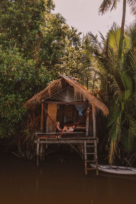 Kampot bamboo riverside resort with kayaks and lush jungle. Tropical destination in Cambodia South East Asia. Cambodia Itinerary, Cambodia Beaches, Return To Nature, Battambang, Cambodia Travel, The Adventure Begins, Kampot, Adventure Begins, Place To Visit