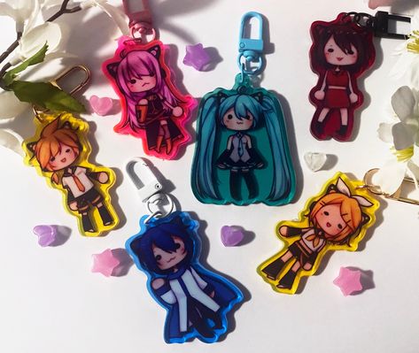 3" one side glitter epoxy coated charms featuring your favorite classic Vocaloids with kitty ears! It is the same design on both sides and is made with transparent colorful acrylic!  Product Details: Material: Acrylic Size: 3" PLEASE NOTE: When your charm arrives, there is a film on both sides that must be PEELED OFF! It might appear scratched at first. Acrylic Keychains, Acrylic Charms, Hatsune Miku, Things To Buy, Vocaloid, Charms, Sketch Book, Kitty, Film