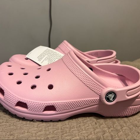 Light pink Crocs Crocs Light Pink, Light Pink Crocs With Charms, Light Pink Crocs Outfit, Taffy Pink Crocs, Pink Crocs With Jibbitz, Pink Crocs Aesthetic, Light Purple Crocs, Preppy Crocs, Crocs Colors