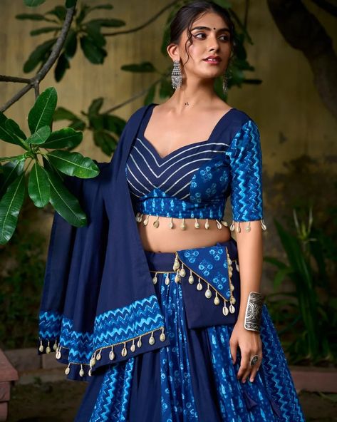 🌟 Elevate your Navratri 2024 with our stunning blue pure cotton Chaniya Choli, adorned with exquisite cowrie shells and a matching purse. Perfect for a night of vibrant celebrations and dance! Embrace elegance and tradition with every step. ✨ #Navratri2024 #ChaniyaCholi #PureCotton #CowrieShells #FestiveFashion #DanceInStyle #WeAreEffortlessly #ElegantTradition #CelebrateInStyle ▪️Lehenga (Stitched) Lehenga Fabric : Pure Cotton Lehenga Work : Plain And Printed With Cowrie (Kodi) Lace Touch ... Blue Chaniya Choli Navratri, Chaniya Choli Poses, Cotton Chaniya Choli, Navratri 2024, Lehenga Stitched, Navratri Collection, Cotton Lehenga, Lehenga Fabric, Stitched Lehenga