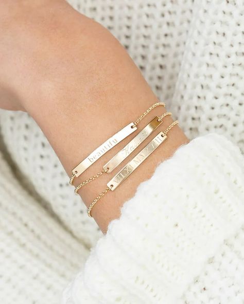 These dainty bar bracelets have to be my favorite accessory! They can have names, dates, words, roman numerals - any writing you wish! PREORDER NOW 🔗 https://kaitlynroseco.com/products/preorder-laser-engraved-personalized-bar-bracelet . . #laserengraved #laserengraving #laserdesign #barbracelet #engravedbracelet #personalizedjewelry #gifts #specialgifts #shopsmall #shoplocal #shophandmade #mamaownedbusiness Engraved Bar Bracelet, Bar Bracelet Personalized, Silver Bar Bracelet, Gold Bar Bracelet, Bracelet Name, Customised Bracelets, Gold Lariat Necklace, Gold Moon Necklace, Evil Eye Necklace Gold