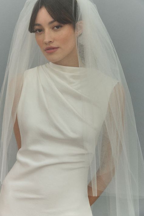 This handmade fingertip veil by BHLDN features gracefully cascading layers of lightweight tulle. | Lilly Fingertip Veil by BHLDN in White, Nylon/Metal/Tulle at Anthropologie Front Veil Wedding, Drop Veil Hair Down, Modern Bridal Veil, Modern Bride Veil, Cathedral Veil With Blusher, Veil Hair Down, Anthropologie Bridal, Fingertip Length Veil, Cascading Layers