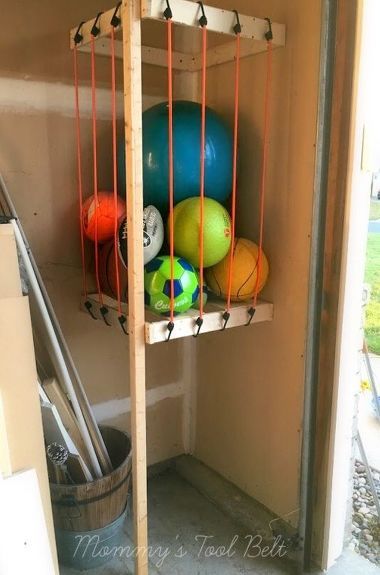 s the newest diy space saving storage ideas to keep your home organized, Garage Ball Storage Diy Declutter, Bike Storage Garage, Diy Space Saving, Diy Organizer, Bike Room, Small Garage, Garage Storage Systems, Diy Space, Ball Storage