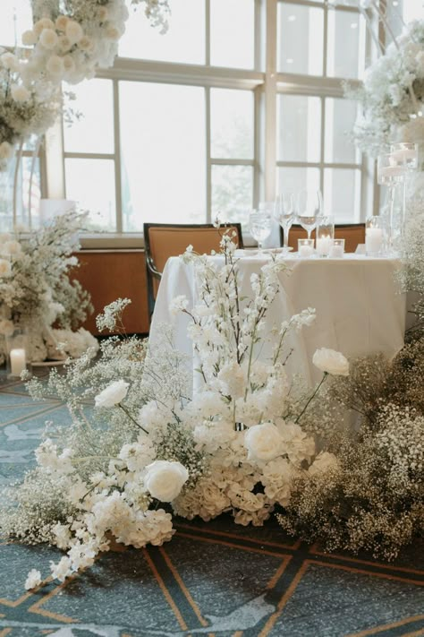 An Elegant Modern White Wedding - Flora Nova Design - Premier Event Design Studio in Seattle White Tall Floral Centerpieces, Baby's Breath Flower Arrangement, Classic White Wedding Theme, All White Modern Wedding, White Florals Wedding, Babies Breath Flowers, Minimalist Wedding Theme, Sweetheart Table Flowers, Modern White Wedding