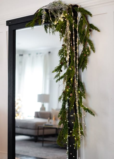 Craftberry Bush | Cozy Christmas Tour Part 2 | https://www.craftberrybush.com White Brick House Christmas Decor, Christmas Garland Bedroom, Christmas Garland Ideas Hallway, Modern Red And Green Christmas Tree, Garland Christmas Ideas, How To Hang Candles From Ceiling, Hanging Light Christmas Decor, Christmas Trellis Outdoor, No Mantel Christmas Decor