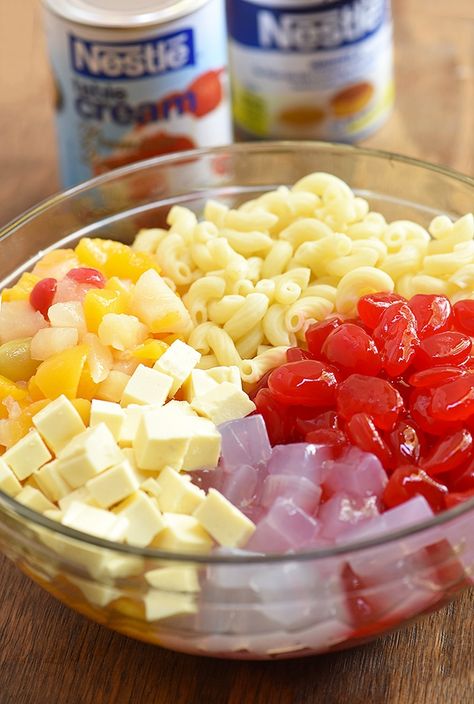 Fruit Salad with pasta and sweetened is the ultimate party dessert. This Filipino salad is creamy, tasty and sure to a crowd favorite. Macaroni Fruit Salad Filipino, Filipino Macaroni Fruit Salad Recipe, Fruit Salad Filipino Style, Macaroni Fruit Salad Recipe, Macaroni Fruit Salad, Macaroni Salad Filipino Style, Filipino Salad, Rose Desserts, Filipino Desert