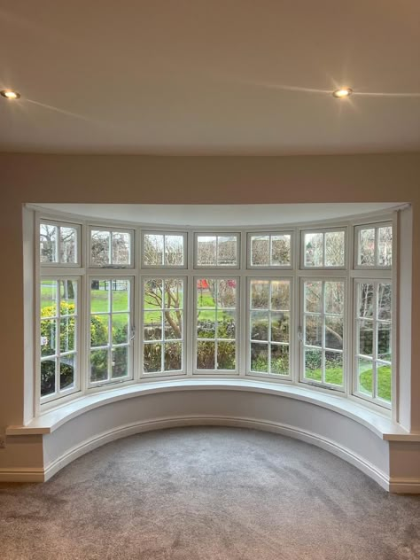 Replacement bay window overlooking a garden Bow Window Dining Room, Bow Window Ideas, House With Bay Window, Bow Window Living Room, Rooms With Windows, Curved Bay Window, Bay Window Replacement, Modern Office Design Inspiration, Bay Window Exterior