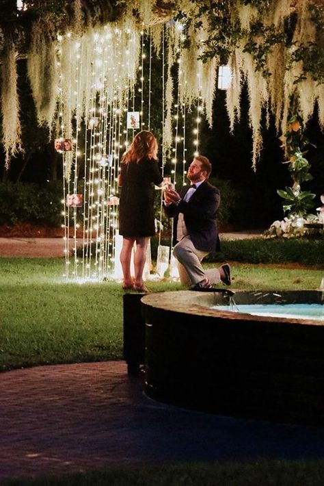 24 Best Proposal Ideas For Unforgettable Moment ❤️ best proposal ideas fairy tale night time proposal ideas with lights on trees near fountain ❤️ See more: https://ohsoperfectproposal.com/best-proposal-ideas/ #bridalsets #diamondrings #weddingringsforwomen #proposalideas #ohsoperfectproposal Night Proposal Ideas, Romantic Outdoor Proposal Ideas, Backyard Proposal Ideas Night, Outdoor Proposal Ideas, Best Proposal Ideas, Outdoor Proposal, Unique Proposals, Proposal Pictures, Wedding Alters