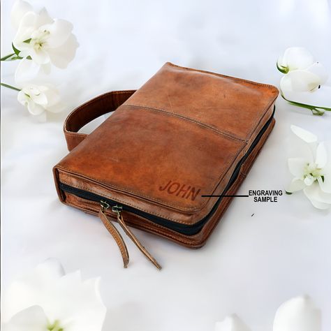 Product Features: 1) Material: Goat and Buffalo Leather 2) Dimensions: Small: 10 X 6.5 X 2 Inches (H X L X W)                             Medium: 11 X 7 X 2.5 Inches (H X L X W)                             Large: 12 X 8 X 3 Inches (H X L X W)                             3) Color: Brown and Black 4) Closure Type: Zipper 5) Pattern: Solid About this item:  Our leather Bible covers are made from premium Goat and Buffalo leather, ensuring heavy-duty durability that can last for generations. The Medi Holy Bible Book, Leather Bible Cover, Bible Cases, Book Protector, Leather Bible, Leather Book Covers, Custom Bible, Personalized Bible, Custom Book Covers