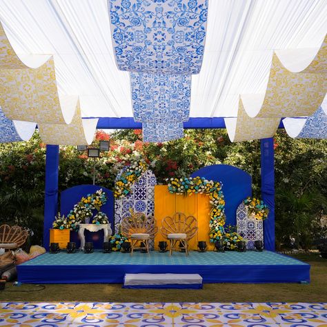 Transform your Haldi ceremony into a dreamy escape with a stunning blue and white theme!💙 Imagine the serene blend of sky hues and pure whites creating a tranquil yet vibrant atmosphere.🤍 Royal Wedding Decor with hues of ivory and gold💛💛 . . Decor by - @wedfieldevents Entertainment by - @wedfieldevents Photography- @wedfield_photography . . . #wedfield #destinationweddings #destinationwedding #decor #luxurywedding #weddingmoments #WeddingDecorTrends #WeddingDecorLove #WeddingFurniture #We... Blue White Yellow Decor, Royal Wedding Decor, Mehendi Backdrop, Event Entrance Design, Ceremony Decorations Indoor, Bollywood Night, Weddings Decorations Elegant Romantic, Haldi Decoration Ideas, Haldi Ceremony Decorations