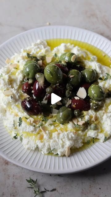 Caroline De Luca on Instagram: "Whipped Ricotta with Olives for a super simple Christmas appetiser you can make in minutes. Serve with crusty bread and enjoy! 

Ingredients
1 ½ cups of That’s Amore Traditional Ricotta
1/4 cup extra virgin olive oil (plus extra for drizzling)
½ cup kalamata olives 
½ cup Sicilian olives
2 tsp baby capers
2 tsp of fresh thyme leaves
Zest of a lemon
1 tbsp crushed almond flakes for serving
1/4 teaspoon salt
Crusty bread or crostini, for serving
 
Method
Place ricotta in a medium bowl and add lemon, extra virgin olive oil and season with salt. Stir to combine well and set aside.
 
To a small saucepan over low heat, add the olives, capers, lemon zest, thyme, olive oil and stir to combine. Taste and adjust seasoning if needed. Heat for 4-5 minutes or just enough Sicilian Olives, Christmas Appetizers Easy, Whipped Ricotta, Olive Oil Recipes, Kalamata Olives, Crusty Bread, Christmas Appetizers, Fresh Thyme, Virgin Olive Oil