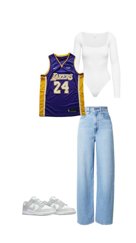 Bring a playful twist to your everyday look with this trendy outfit! Start with classic blue jeans and a fitted white long-sleeve bodysuit for a sleek base. Layer on a bold Lakers basketball jersey for that sporty edge, and finish with stylish grey and white Nike Dunks for ultimate comfort and flair. Perfect for game days or casual outings with friends! 💜💛✨ #SportyChic #CasualStyle #OOTD Outfits With Blue Nike Dunks, Women’s Basketball Jersey Outfit, Basketball Wife Aesthetic Outfit, Basketball Jersey Outfit Women Winter, Lakers Jersey Outfit Woman, Basketball Game Outfit Women Jersey, How To Style A Basketball Jersey Women, Outfit For Basketball Game, Hockey Outfits For Women