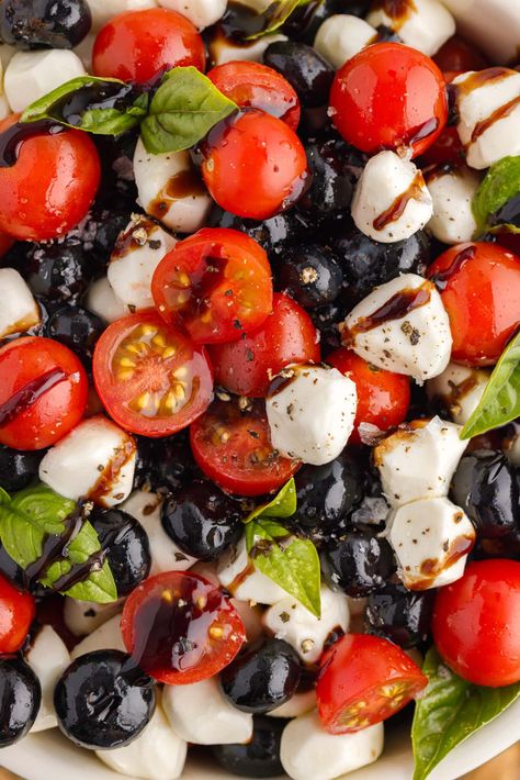 This red white and blue caprese salad is speckled with plump blueberries, cherry tomatoes, fresh basil, and mozzarella pearls then tossed with balsamic glaze making a refreshing side to bring to all your patriotic potlucks! Salted Nut Roll Shot, Red White Blue Food, Boozy Ice Pops, Memorial Day Desserts, Tomato Mozzarella Basil, Tomato Caprese, Mozzarella Pearls, Blueberry Salad, 4th Of July Dessert