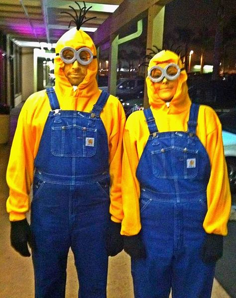 Halloween 2013, the hubby and I as Minions (from Despicable Me 1 & 2)...great adult duo costume!! Super comfy and an easy DIY project;) -2 yellow hoodies -2 pair of overalls (Carhart is the brand we're wearing). We had to purchase ours which, unfortunately, made this the most expensive part if the costume idea. But we won 2nd place! :D -2 pair black cotton gloves -1 large pot of yellow face make up -1 pkg black pipe cleaners -2 pcs of blk foam -1 pc grey felt -1 ok blk elastic strap Trio Halloween Costumes Minions, Oversized Halloween Costumes, Duo Halloween Costumes Minions, Minion Duo Costume, Paired Halloween Costumes, Halloween Minion Costume, Duo Costume Ideas Funny, Pair Costume Ideas, Halloween Costumes Pairs