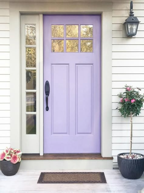 “Soft lilac stands out against the cream siding of this house without being too strong — just what the homeowner wanted. I originally went a shade lighter, but I chose this one knowing the door is in the sun a lot of the time. It’s fresh and new, yet it feels like it’s belonged all along.” — Kelli Webber, Buyers Desire, Boston, MA Light Purple House Exterior, Light Purple Front Door, Lavender Front Door Paint Colors, Lavender Front Door White House, Cream Siding, Lilac Door, Purple Kitchen Cabinets, Purple Front Door, Lavender Interior