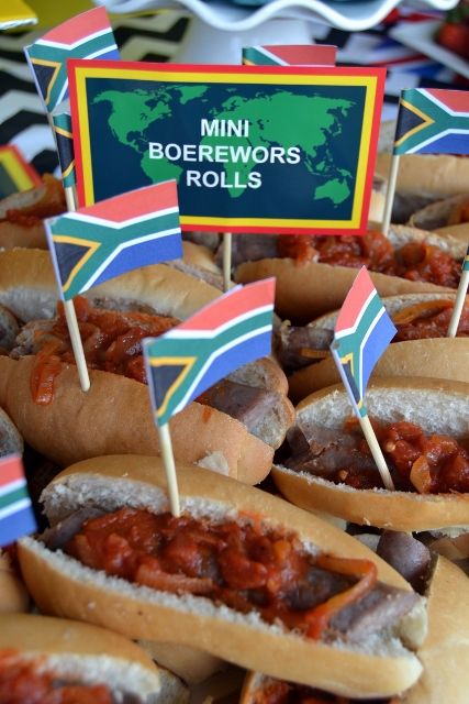 Mini South African Boerewors Rolls South African Heritage Day Decor Ideas, South Africa Theme Party, Heritage Day Decor South Africa, South African Platters, South African Decor Ideas, South Africa Party Decorations, Springbok Party Ideas, Boerewors Rolls South Africa, South African Party Theme