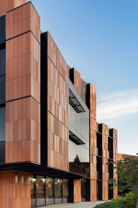 The building counters the tech industry's minimalist, austere aesthetic with a warm, welcoming environment for students and faculty. It features a unique design with a single alveolar ceramic panel, created in eight variations: scratched or smooth, and unglazed, matte, or gloss finish. @gresmanc  #architonic #architecture #facade #exteriordesign #facadedesign #exterior #facadesystem #modernarchitecture #buildingdesign #buildingelements Austere Aesthetic, Concrete Panel Facade, Office Building Facade, Industrial Building Facade, Panel Facade, Industrial Facade, Bill And Melinda Gates, Aesthetic Tech, Ceramic Panel