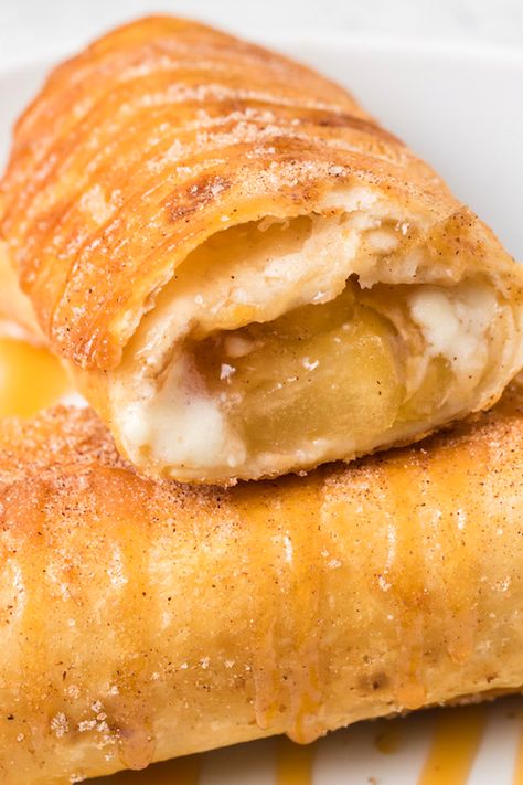 Deep-fried caramel apple cheesecake chimichangas. Cheesecake Chimichangas, Deep Fried Desserts, Fried Cheesecake, Chimichanga Recipe, Fried Dessert, Canned Apple Pie Filling, Caramel Apple Cheesecake, Apple Cheesecake, Fall Dessert