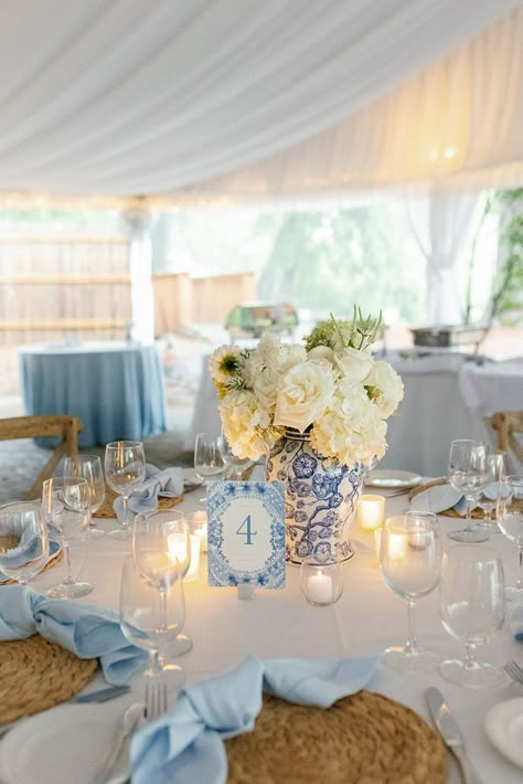 We loved being a part of this wedding at Canoe Restaurant and providing our Sky Linens, Hemstitch Napkins and White Table runners to bring this beautiful design by Gloria Schulz Events to life! We also cannot get enough of these beautiful ginger jars and wicker elements, florals by Pollyanna Richter Weddings and photographed by Maddie Sullivan. White Linen Table Setting Wedding Ideas, Blue And White Vase Centerpiece Wedding, Chinoiserie Wedding Table Settings, Coastal Table Setting Wedding, Blue White Wedding Table Decor, Chinoiserie Centerpiece Wedding, Coastal Wedding Decor Wedding Table Decor, Costal Wedding Centerpiece, Ginger Jar Wedding Reception